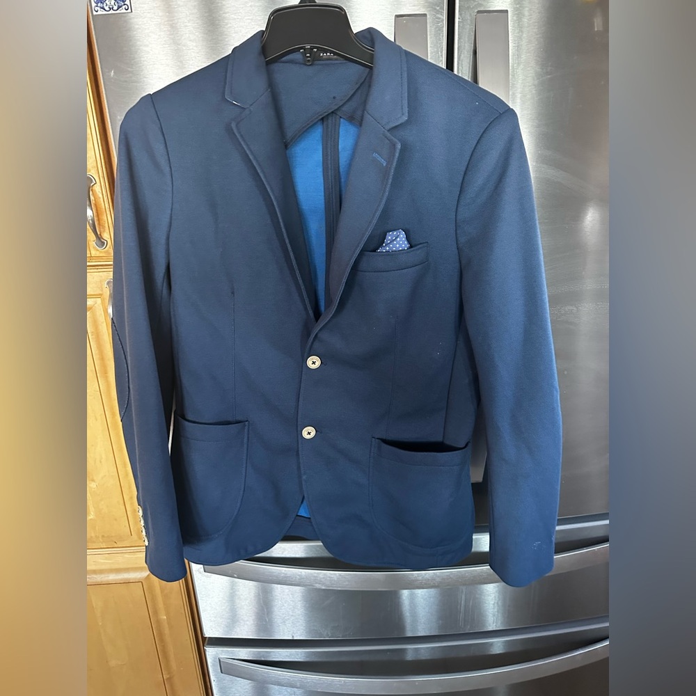 Mens blue color blazer.
2 button.